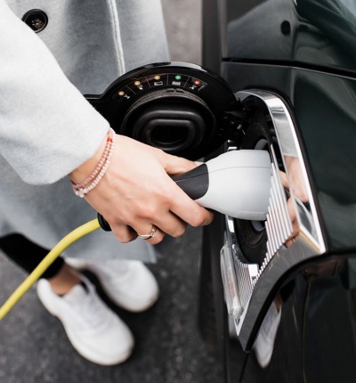 Woman Charging Her Car