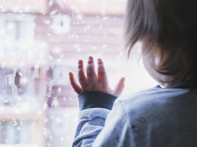 Child looking out of window