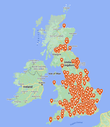 A map of the UK covered in red pinpoints showing Mcdonalds locations