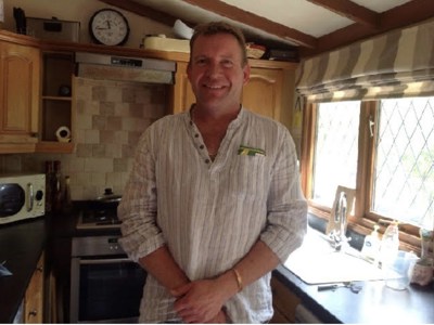 David Daly standing in kitchen.