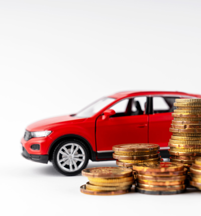 Red Car And Stack Of Coins On White Background