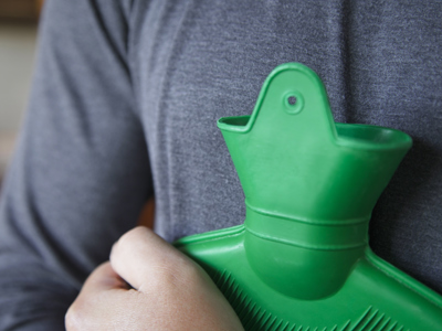 Person Holding Hot Water Bottle (1)