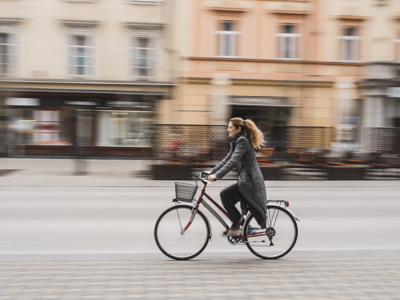 Woman cycling through city
